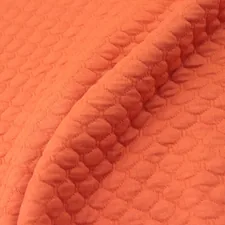a close up view of an orange blanket related to Twin Matelasse Coverlet Sale | Discounted Prices