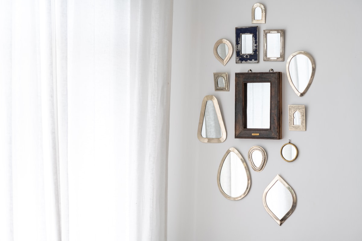 a collection of Moroccan mirrors on a wall related to Elegant Mirror Images: 3 Captivating Mirrored Buffet Sideboard Designs