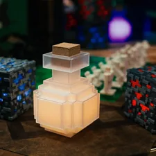 a couple of blocks sitting on top of a table related to Minecraft Bed Set Dreams: The Ultimate Sleeping Experience for Gamers