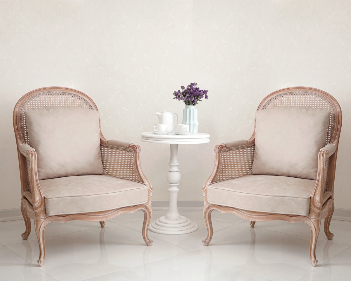 a couple of chairs sitting next to each other related to Timeless Elegance: French Style Sideboards
