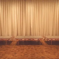a couple of tables sitting on top of a hard wood floor related to Beds That Sit on the Floor: A Comprehensive Guide