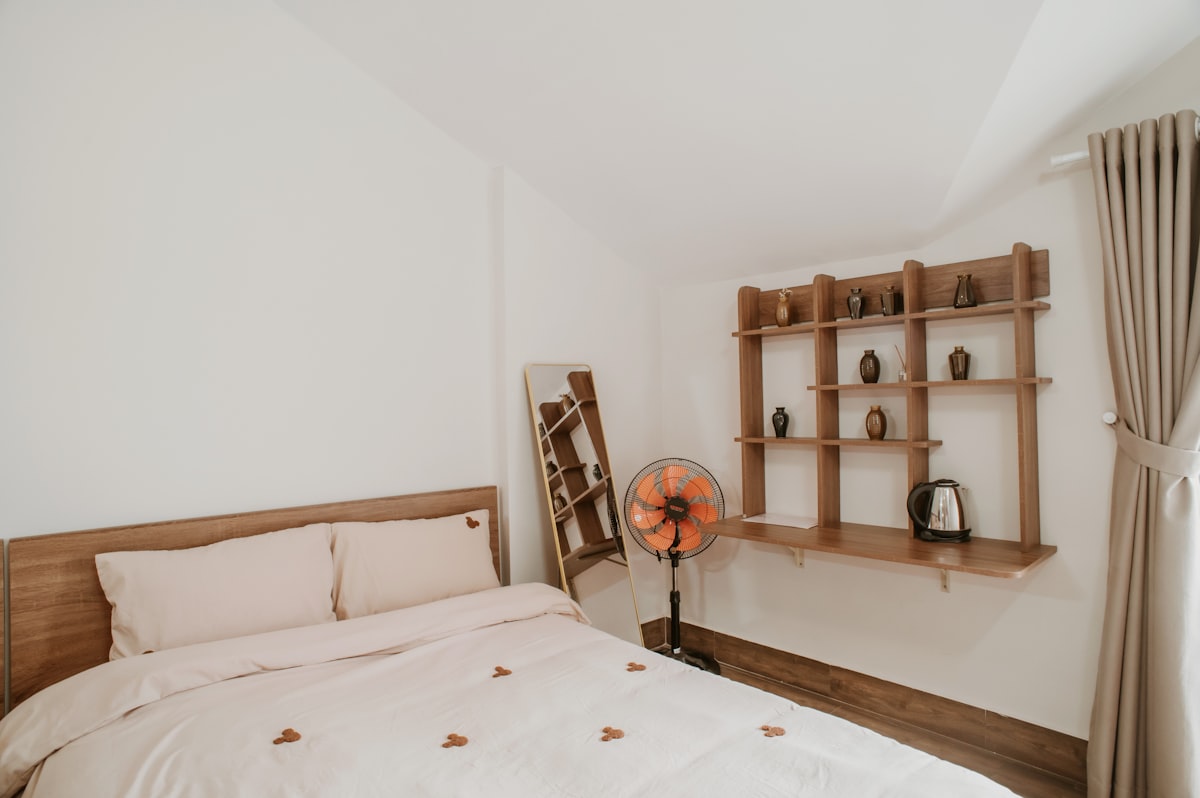 A cozy bedroom decorated with wooden accents. related to Maximize Your Space: The Ultimate Guide to Bed with Shelves