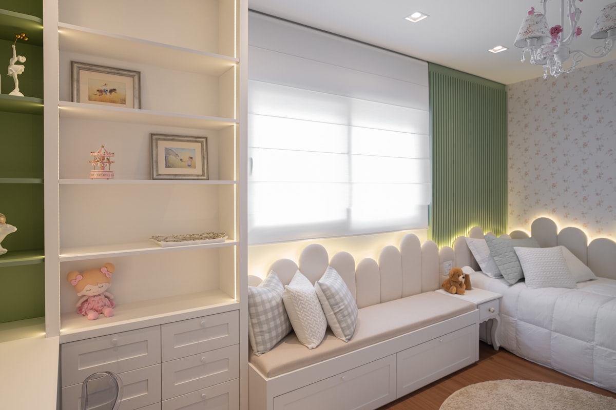 A cozy bedroom with a window seat and shelves. related to Nursery Valance Curtains: Add a Touch of Elegance to the Nursery