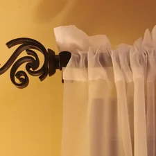 a curtain is hanging on the side of a window related to How to Hang Curtains with Valance
