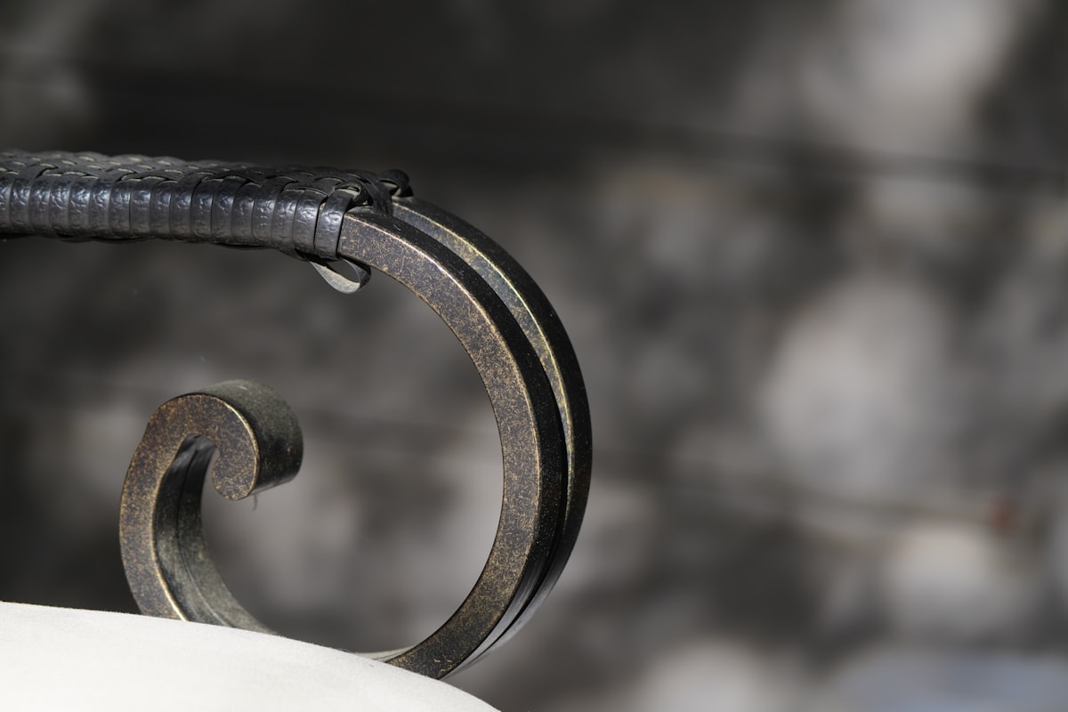 A decorative, swirled metal railing section. related to Timeless Elegance: Choosing the Perfect Wrought Iron Sideboard