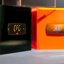 A digital clock sitting on top of a table related to Exploring Indoor Tanning Options at Your Gym
