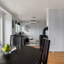 A dining room table with a bowl of fruit on it related to Maximizing Space and Comfort with Lowe's Bed Risers