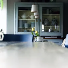 a dining room table with blue chairs and a china cabinet related to Kitchen Sideboard Table