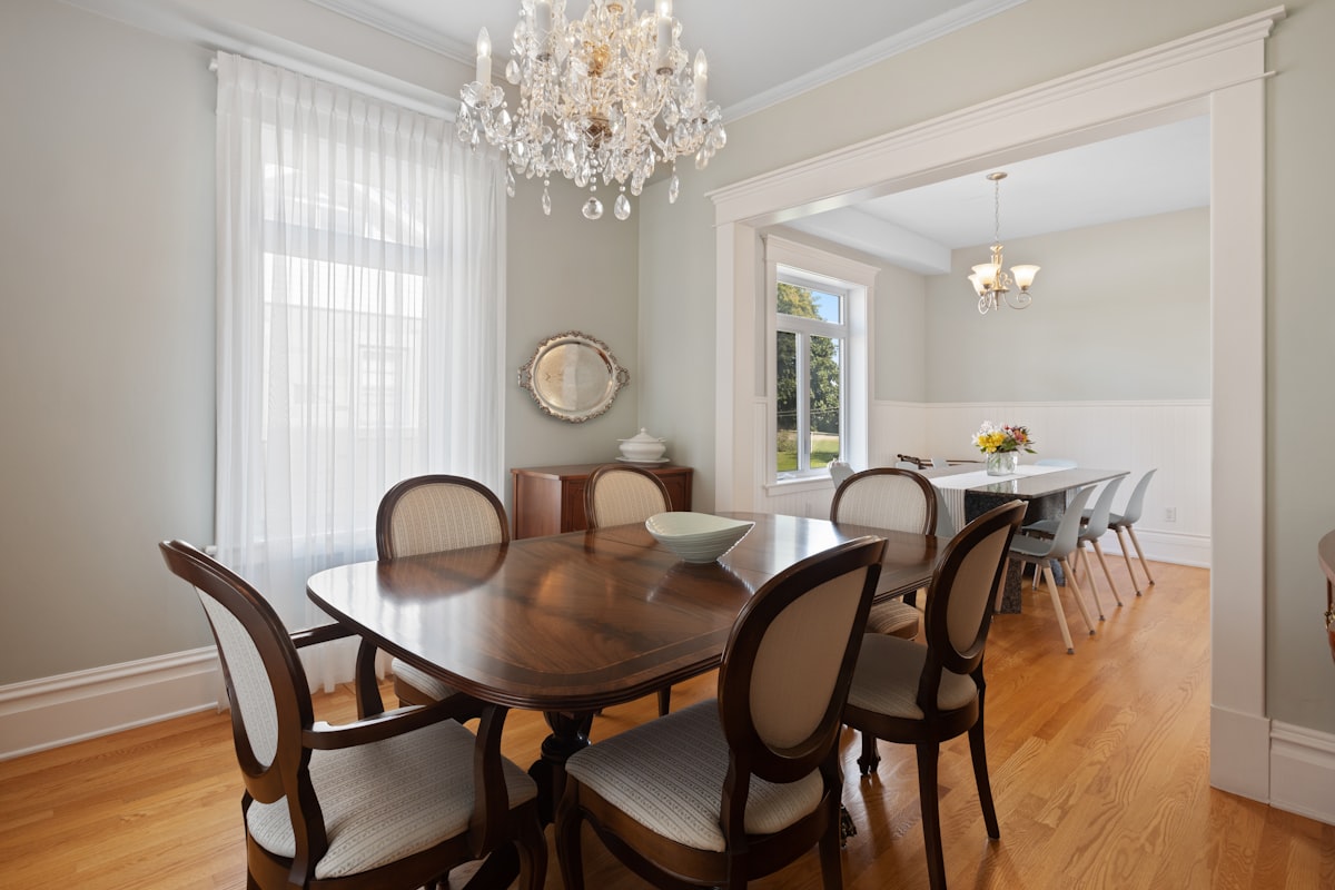 a dining room table with chairs and a chandelier related to Valances for Dining Room