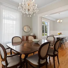 a dining room table with chairs and a chandelier related to Valances for Dining Room
