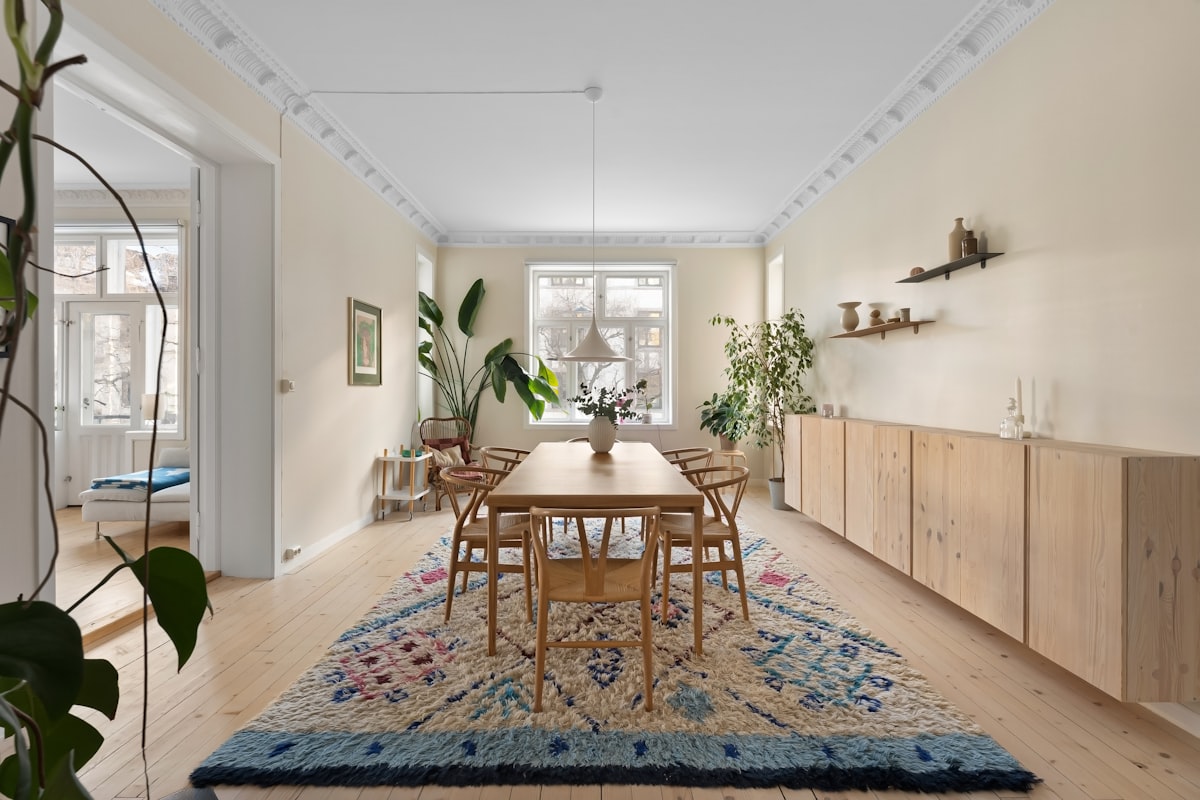 A dining room with a rug on the floor related to Niels Jonsson Sideboard: A Timeless Classic Reimagined