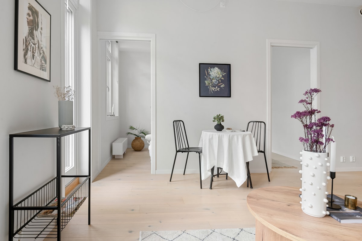 A dining room with a table and chairs related to Elevating the Foyer: The Round Table Entryway