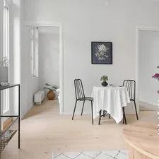 A dining room with a table and chairs related to Elevating the Foyer: The Round Table Entryway