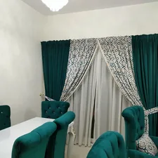 a dining room with green chairs and a white table related to Curtains and Valances Sets