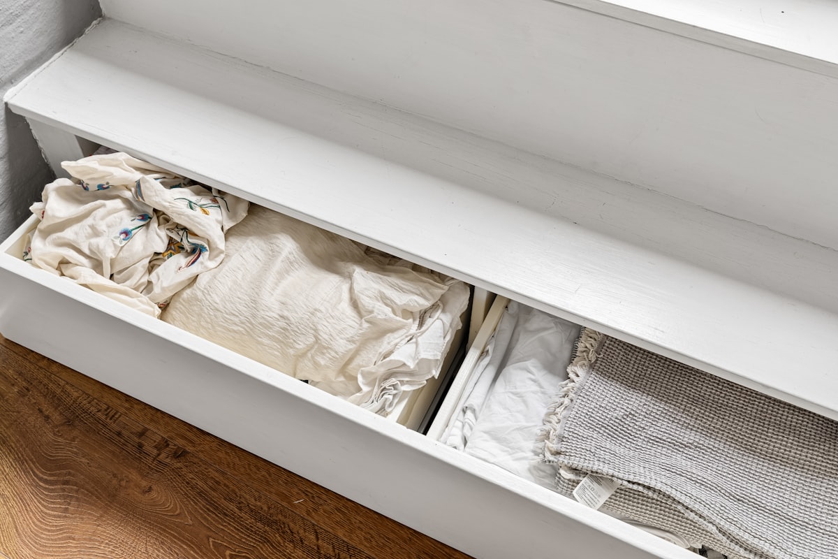 A drawer that has some clothes in it related to The Perfect Storage Bench for Your Entryway: Organize Your Home in Style