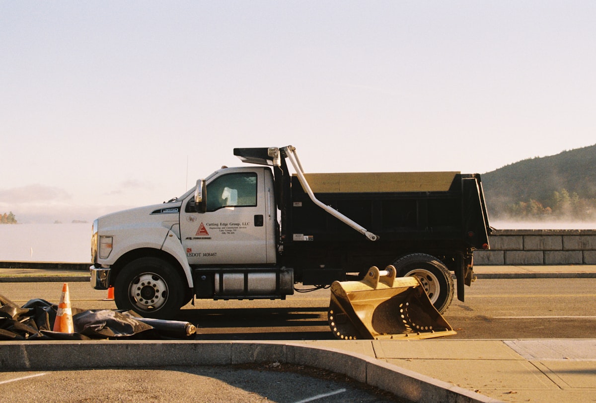 a dump truck parked on the side of the road related to The Ultimate Guide to Hydraulic Dump Bed Kits