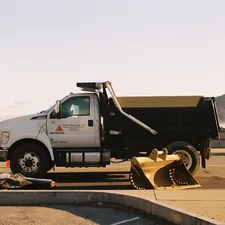 a dump truck parked on the side of the road related to The Ultimate Guide to Hydraulic Dump Bed Kits