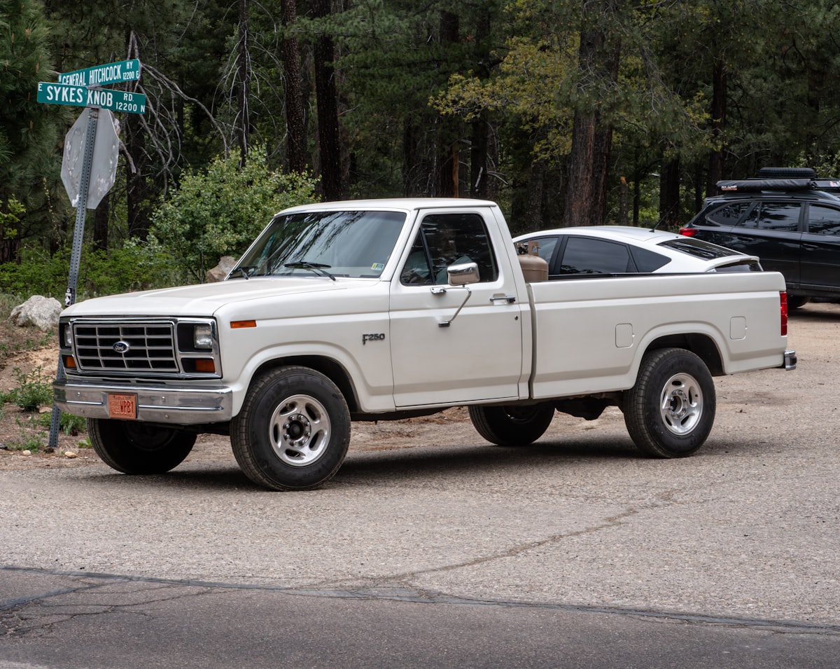 A Ford F250 pulling out of a parking lot by Mt. Lemmon related to Finding the Perfect F250 Truck Bed for Sale