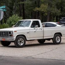A Ford F250 pulling out of a parking lot by Mt. Lemmon related to Finding the Perfect F250 Truck Bed for Sale
