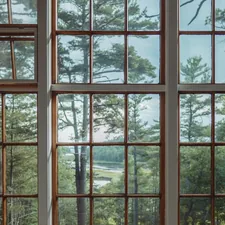 A forested landscape behind a large, vintage, window.  related to Elevate Your Windows with Window Swags and Valances Patterns