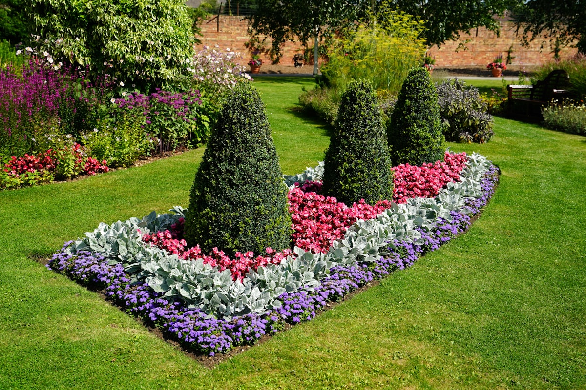 a garden with bushes and flowers related to The Ultimate Guide to Choosing the Best Garden Bed Liner