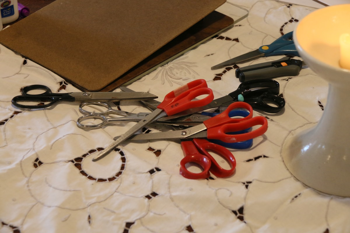 A gathering of scissors, laid out and ready for group action on a crafting project.  Tools of the trade.   related to How to Make Valances Without Sewing