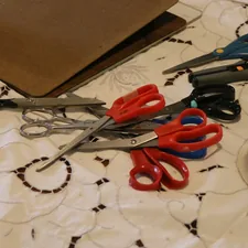 A gathering of scissors, laid out and ready for group action on a crafting project.  Tools of the trade.   related to How to Make Valances Without Sewing