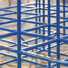 A group of blue metal structures sitting on top of a dirt field related to Exploring the Charm and Functionality of Blue Bunk Beds