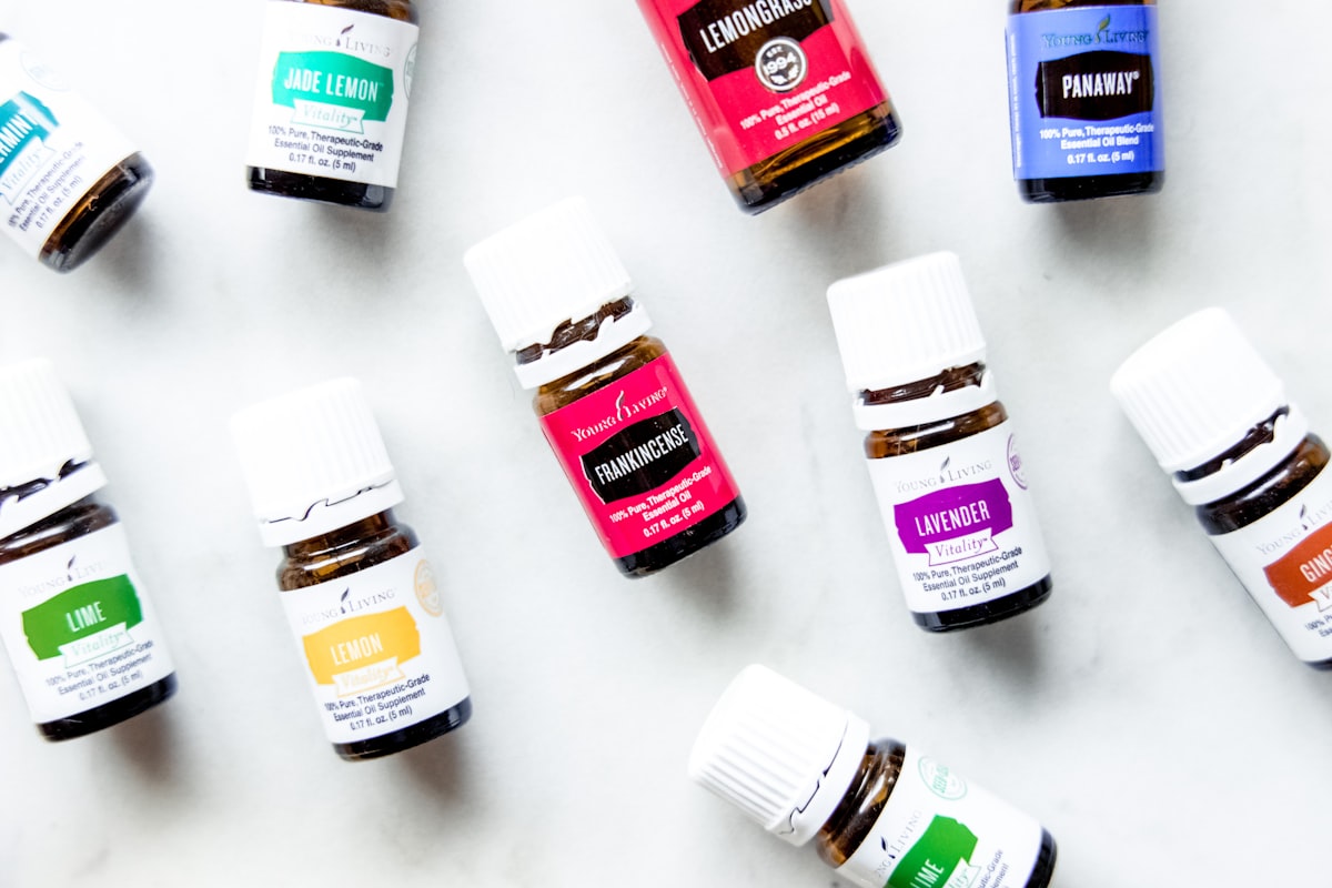 a group of bottles of essential oils on a table related to Essential Oils for Bed Bug Bites: Natural Remedies for Relief