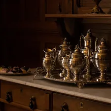 a group of glass jars on a counter related to Elegant Elegance: The Timeless Charm of Antique Sideboards and Servers