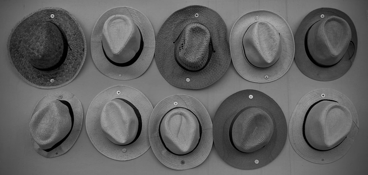 a group of hats hanging on a wall related to Exploring Different Styles of Valances