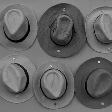 a group of hats hanging on a wall related to Exploring Different Styles of Valances