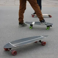 A group of people riding skateboards down a street related to Exploring the Versatility of Sideboards: A Comprehensive Guide