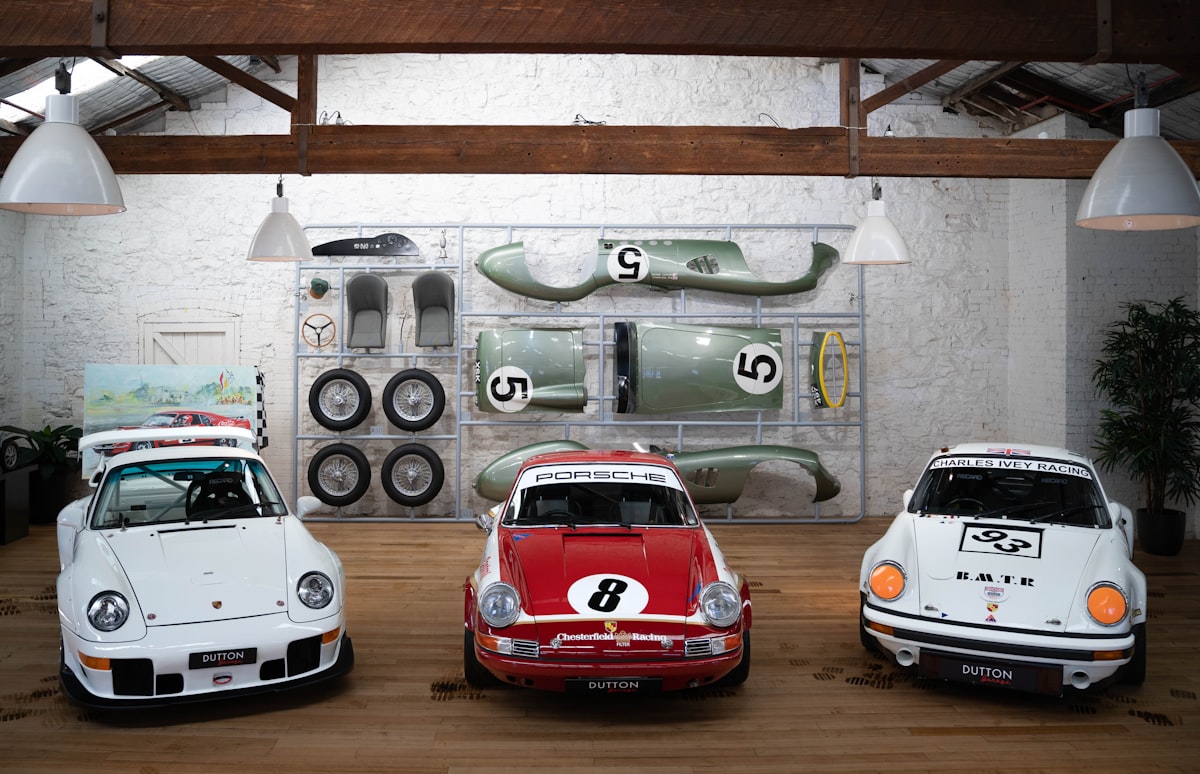 a group of three cars parked next to each other related to Rev Up Your Child's Bedroom with Exciting Race Car Beds for Sale