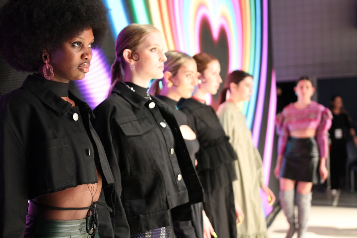 a group of women standing next to each other on a runway related to Exploring Different Styles of Valances
