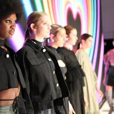 a group of women standing next to each other on a runway related to Exploring Different Styles of Valances