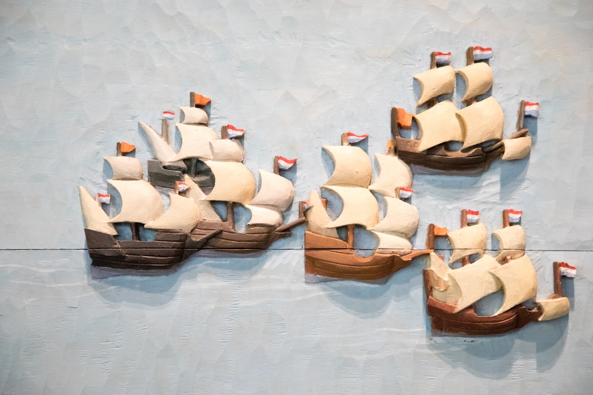 a group of wooden boats on display on a wall related to Why Pirate Ship Beds Are Every Kid's Dream Bedroom Addition