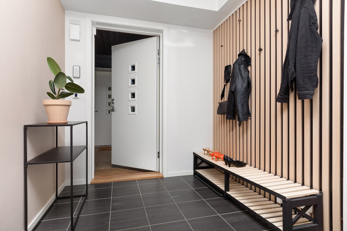 A hallway with a bench and coat rack related to Elevate Your Entryway: The Benefits of Modular Furniture