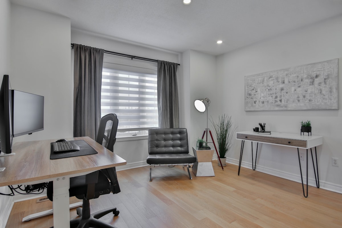 a home office with a desk, chair, and computer related to Transform Your Space with Custom Drapes and Valances: A Comprehensive Guide