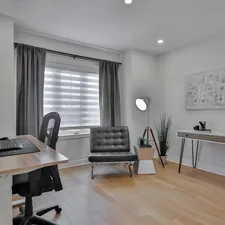 a home office with a desk, chair, and computer related to Transform Your Space with Custom Drapes and Valances: A Comprehensive Guide