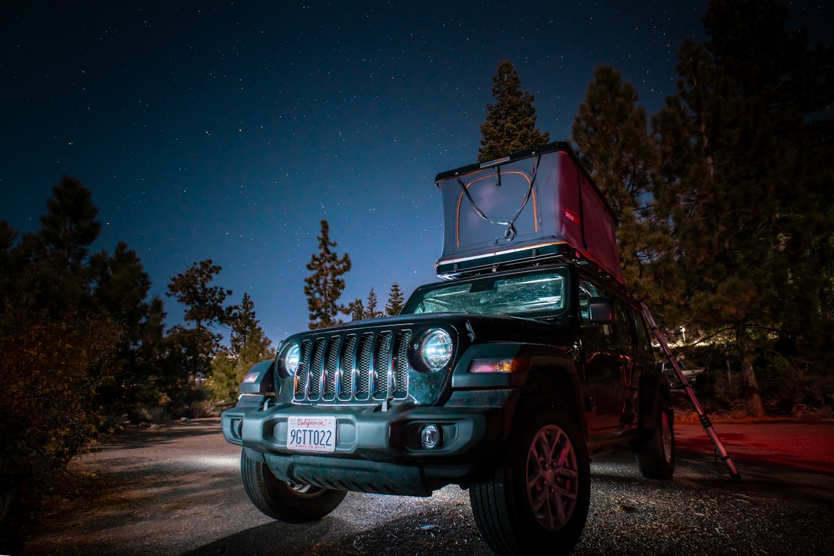 A jeep with a tent on top of it related to The Ultimate Jeep Car Bed Guide