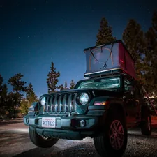 A jeep with a tent on top of it related to The Ultimate Jeep Car Bed Guide