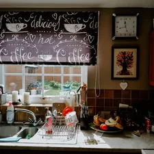 a kitchen sink under a window with a clock above it related to Kitchen Valance Patterns: Elevate Your Kitchen Decor