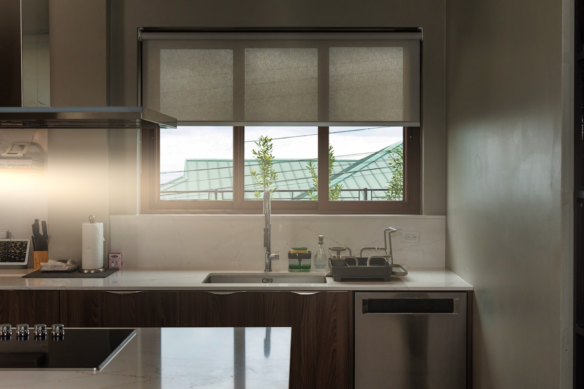a kitchen with a sink, dishwasher and a window related to Kitchen Curtain Valance: A Guide to Styling Your Kitchen Windows