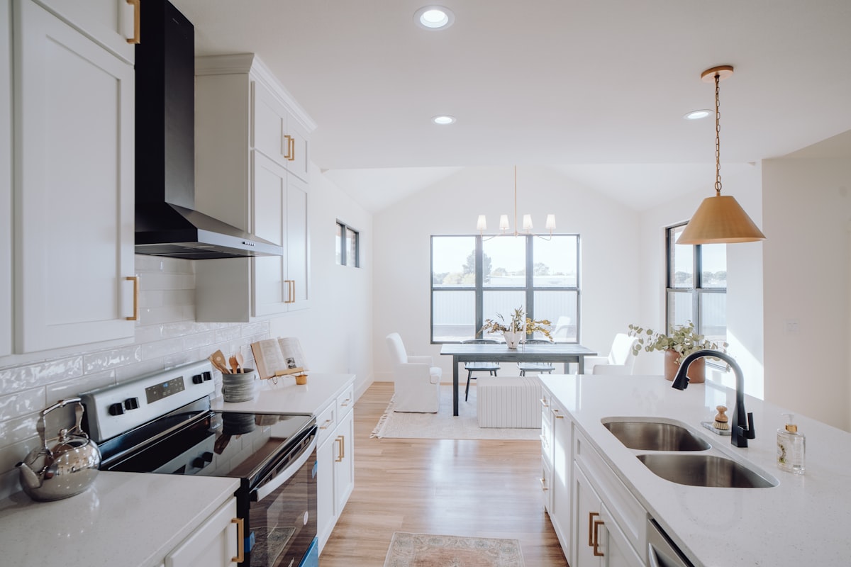 a kitchen with a sink, stove, and a window related to Enhance Your Home's First Impression with a Ceramic Tile Entryway