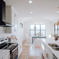 a kitchen with a sink, stove, and a window related to Enhance Your Home's First Impression with a Ceramic Tile Entryway