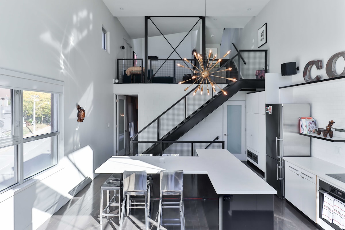 a kitchen with a staircase related to Building Up: A Step-by-Step Guide on How to Make a Loft Bed