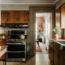 A kitchen with a stove, sink, and refrigerator related to Timeless Elegance: A Guide to Retro Kitchen Curtains and Valances