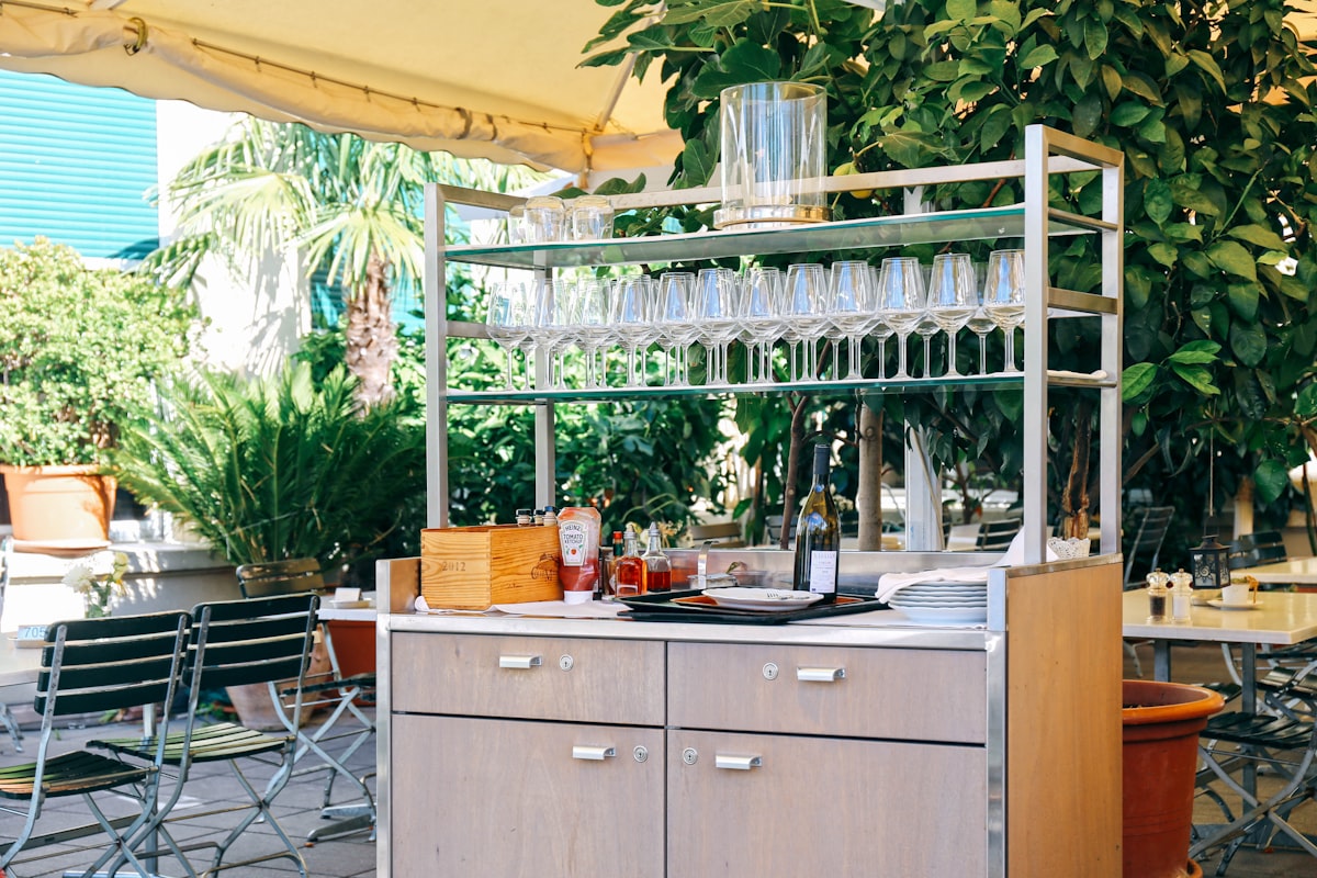 a kitchen with a table and chairs related to Elevate Your Wine Collector's Paradise: Wine Sideboard Furniture
