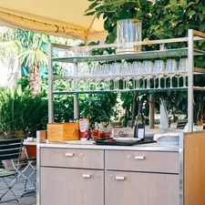a kitchen with a table and chairs related to Elevate Your Wine Collector's Paradise: Wine Sideboard Furniture